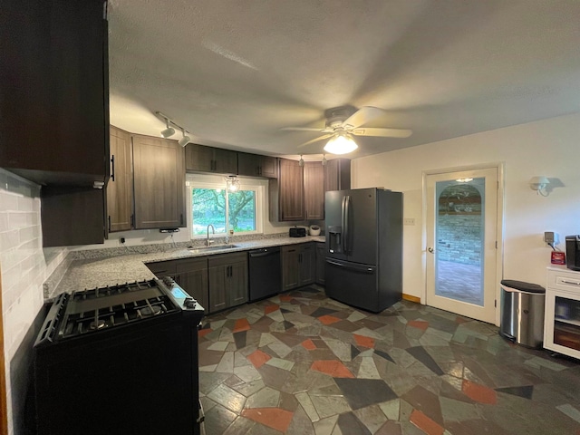 kitchen featuring tasteful backsplash, dark brown cabinets, ceiling fan, sink, and black appliances