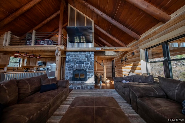 living room featuring wood ceiling, beamed ceiling, and hardwood / wood-style floors