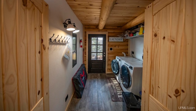 washroom featuring wood ceiling, washing machine and dryer, and dark hardwood / wood-style floors