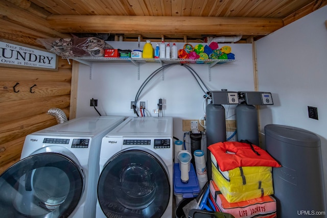 clothes washing area featuring wooden ceiling and washing machine and clothes dryer