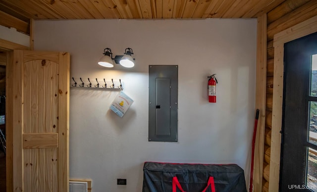 bathroom with wood ceiling, electric panel, and plenty of natural light