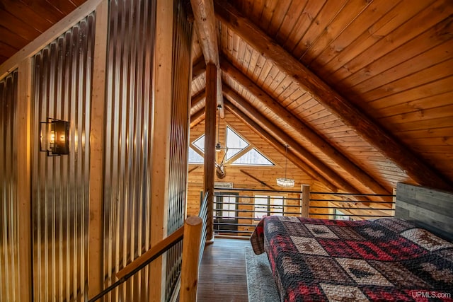 unfurnished bedroom with lofted ceiling with skylight, hardwood / wood-style flooring, wood ceiling, and wood walls