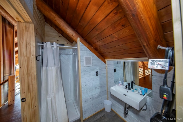 bathroom featuring wood walls, wood-type flooring, wood ceiling, vaulted ceiling, and a shower with curtain