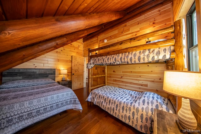 bedroom with dark hardwood / wood-style flooring, wooden walls, vaulted ceiling, and wooden ceiling