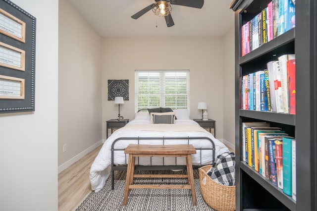 bedroom with hardwood / wood-style floors and ceiling fan