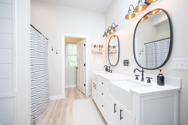 bathroom featuring vanity and hardwood / wood-style floors