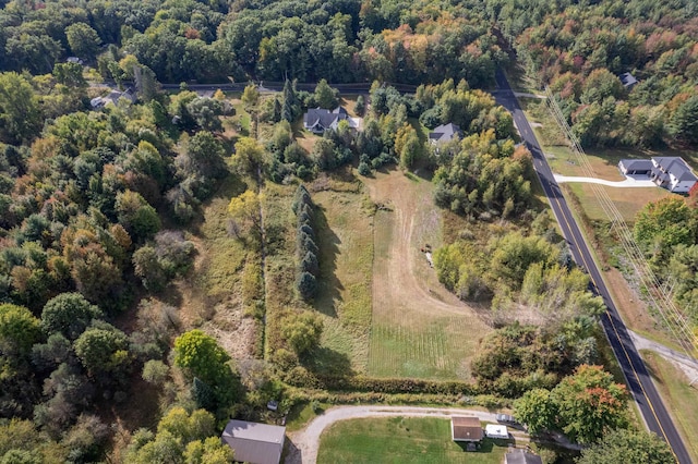 birds eye view of property with a rural view