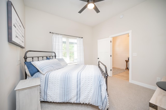 bedroom featuring ceiling fan and light carpet