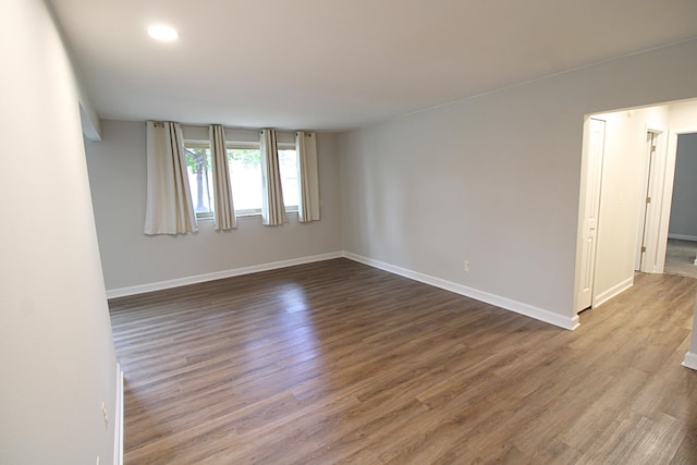 empty room with wood-type flooring