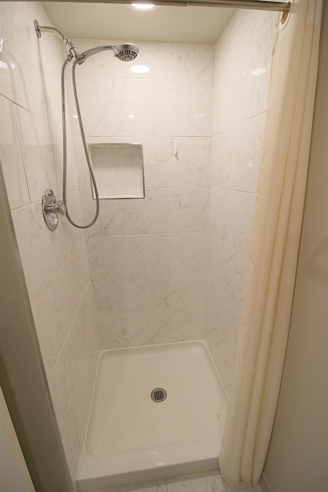 bathroom with a shower with curtain