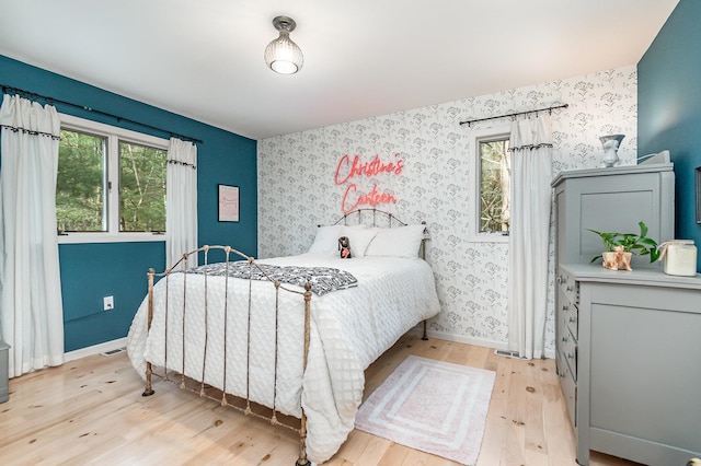 bedroom with light hardwood / wood-style floors