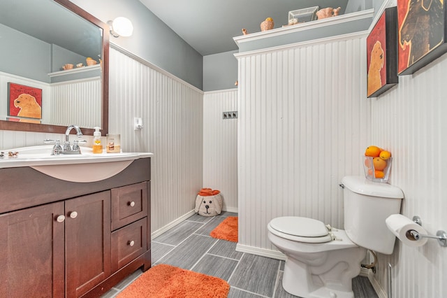 bathroom featuring vanity and toilet