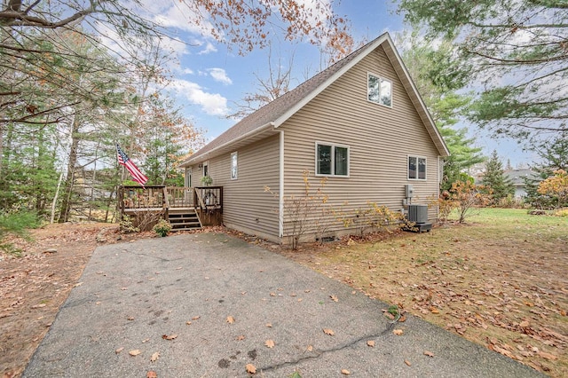 view of side of property with a deck