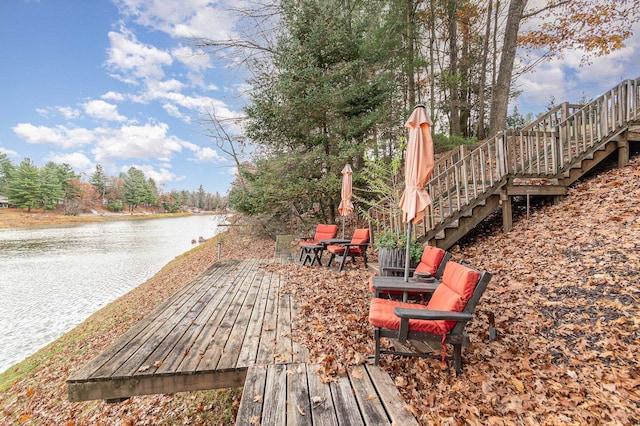 wooden terrace with a water view