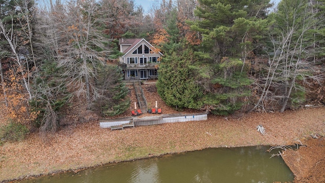 rear view of property featuring a water view