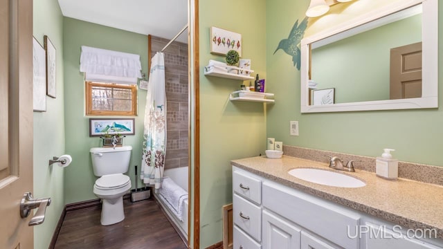 full bathroom featuring hardwood / wood-style floors, vanity, toilet, and shower / bathtub combination with curtain