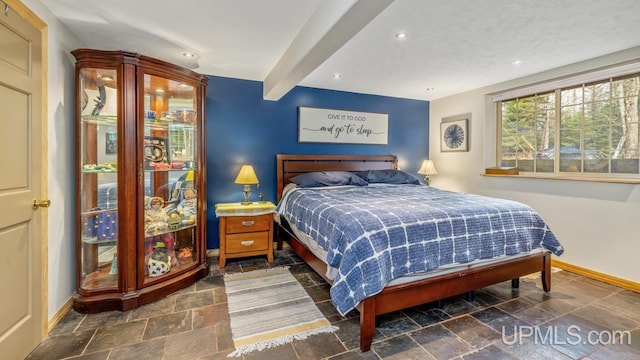 bedroom with beamed ceiling