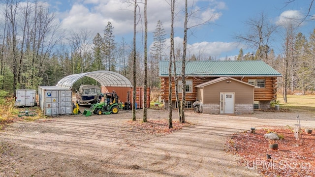 exterior space with a carport