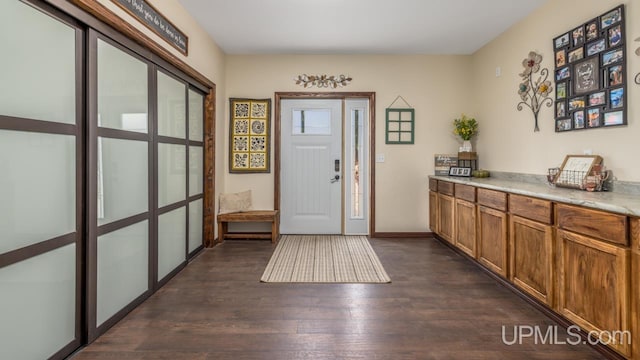 entrance foyer featuring dark hardwood / wood-style floors