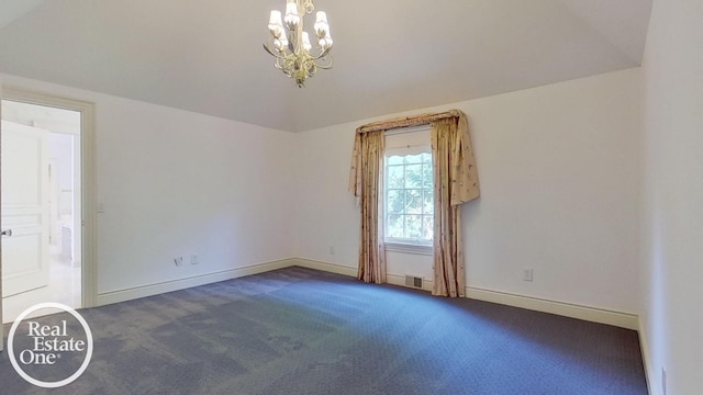 unfurnished room with vaulted ceiling, an inviting chandelier, and dark colored carpet