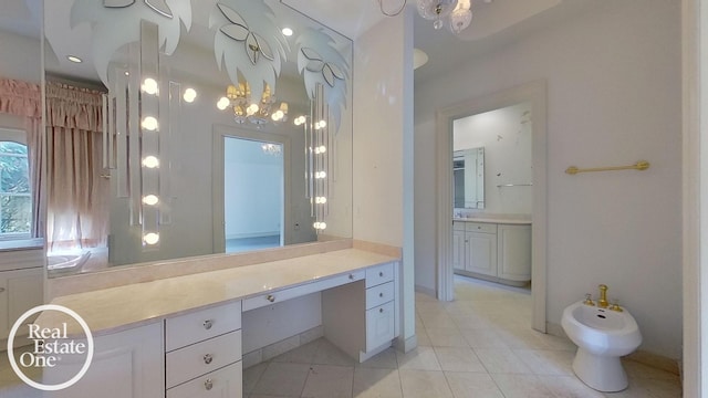 bathroom featuring vanity, a bidet, and tile patterned flooring