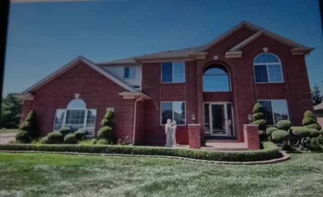 view of front of home with a front yard