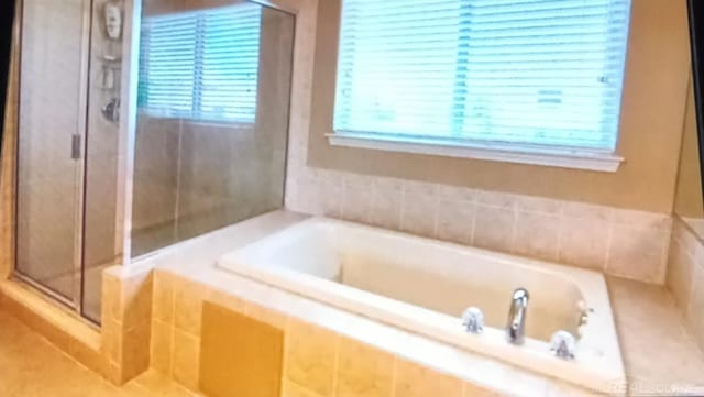 bathroom with independent shower and bath