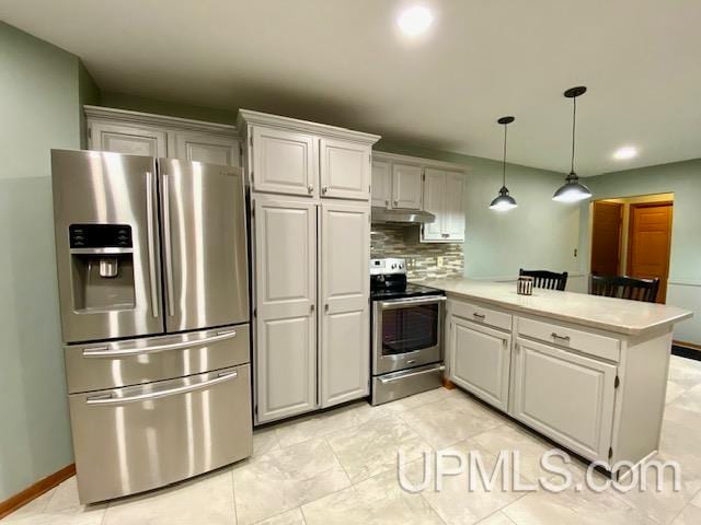 kitchen with white cabinetry, hanging light fixtures, backsplash, kitchen peninsula, and appliances with stainless steel finishes