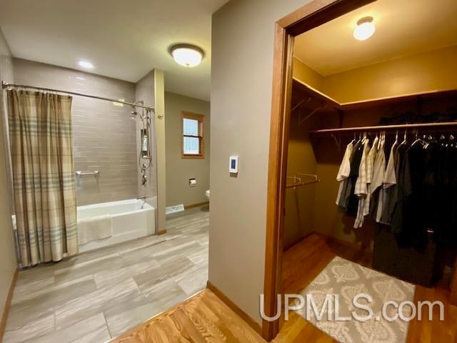 interior space featuring shower / tub combo