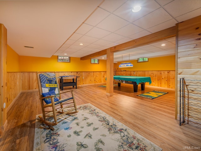 rec room featuring wooden walls, a drop ceiling, pool table, and hardwood / wood-style flooring