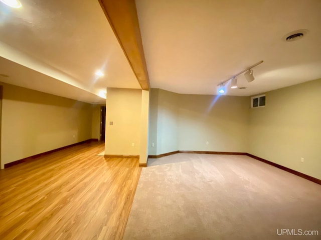 additional living space featuring light hardwood / wood-style flooring