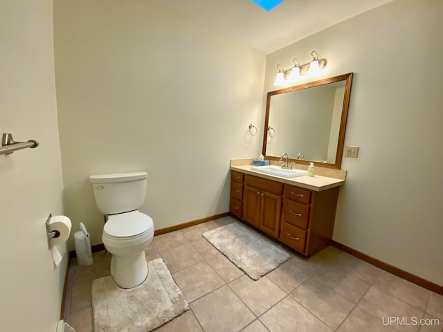 bathroom with tile patterned floors, vanity, and toilet