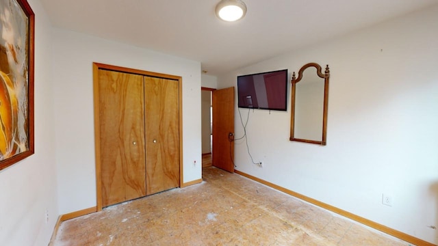 unfurnished bedroom with a closet