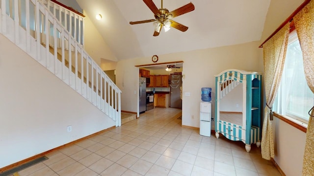 interior space featuring plenty of natural light, lofted ceiling, and ceiling fan