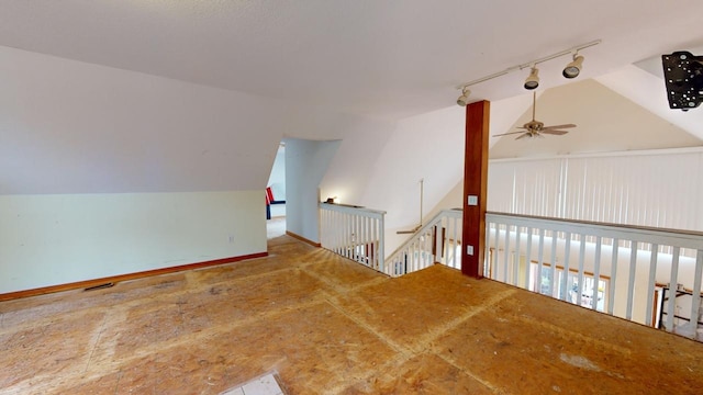 additional living space featuring lofted ceiling and ceiling fan