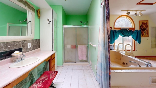 bathroom featuring vanity, tile patterned floors, and separate shower and tub