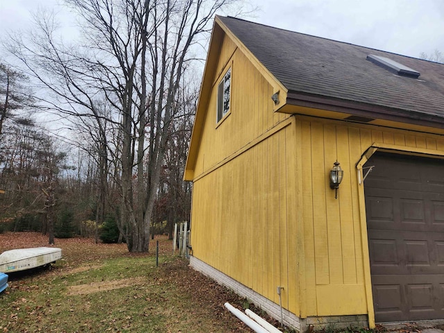 view of side of property with a garage