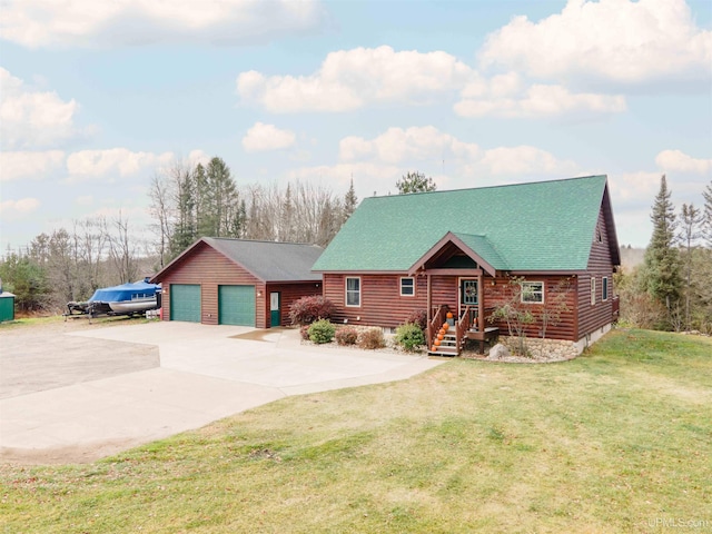 cabin with a front lawn and a garage