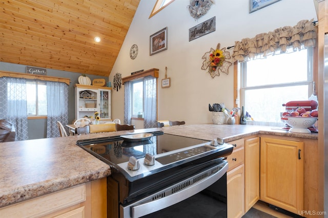 kitchen with light brown cabinets, a wealth of natural light, wood ceiling, and electric stove