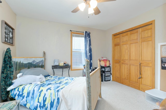 bedroom with carpet flooring, ceiling fan, and a closet