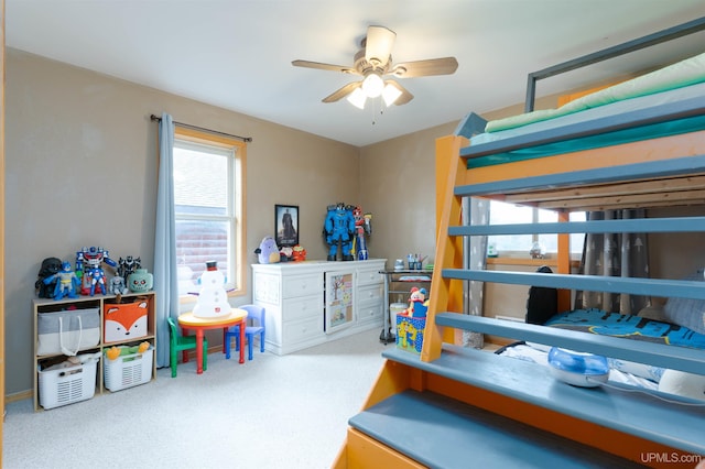 carpeted bedroom with ceiling fan