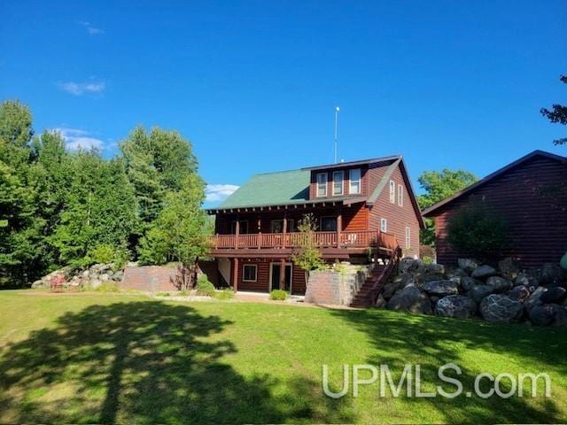371 Morrison Creek Rd, Iron River, MI 49935 - rear view of property featuring a yard, stairway, and a deck