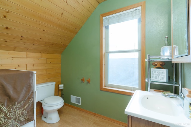 bathroom with hardwood / wood-style floors, vanity, wood ceiling, toilet, and vaulted ceiling