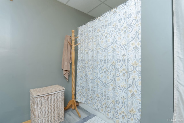 bathroom featuring a drop ceiling