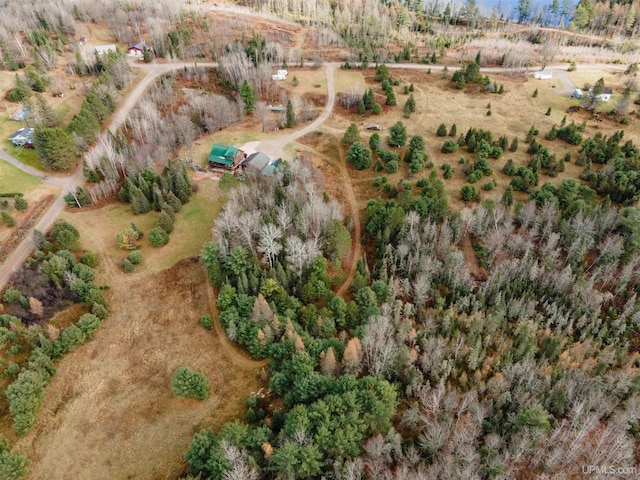 birds eye view of property with a rural view