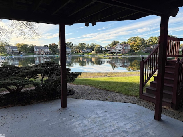 view of patio featuring a water view