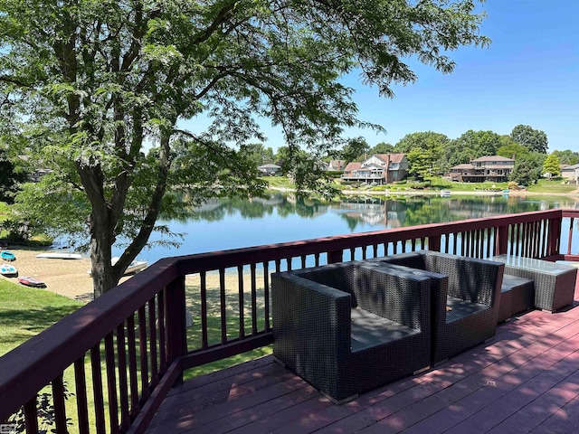 wooden deck with a water view