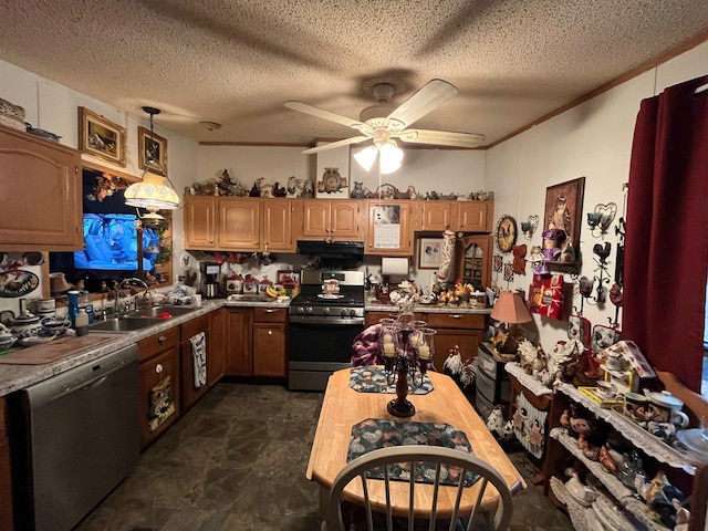 kitchen featuring a textured ceiling, sink, decorative light fixtures, and appliances with stainless steel finishes