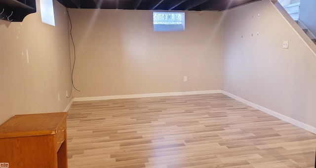 basement featuring light wood-type flooring