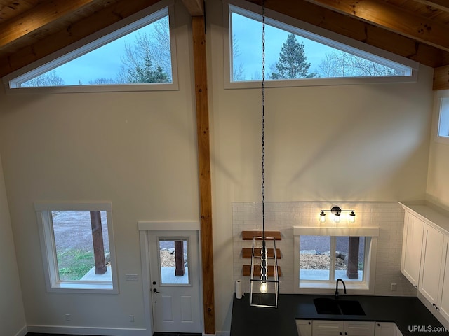 room details with wooden ceiling, beam ceiling, and sink